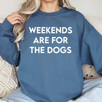 Blue weekends are for the dogs modeled by a woman sitting on a couch.